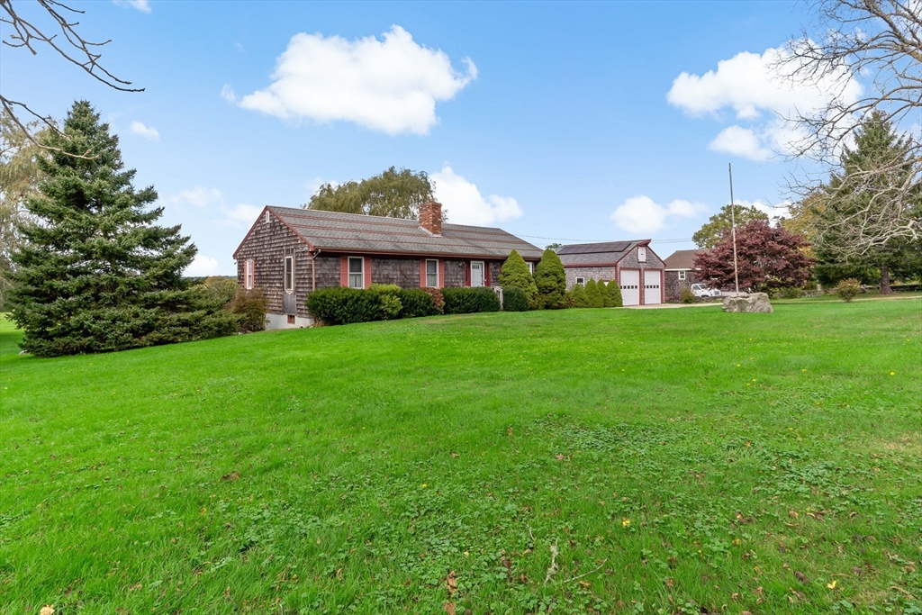 a view of a house with a big yard