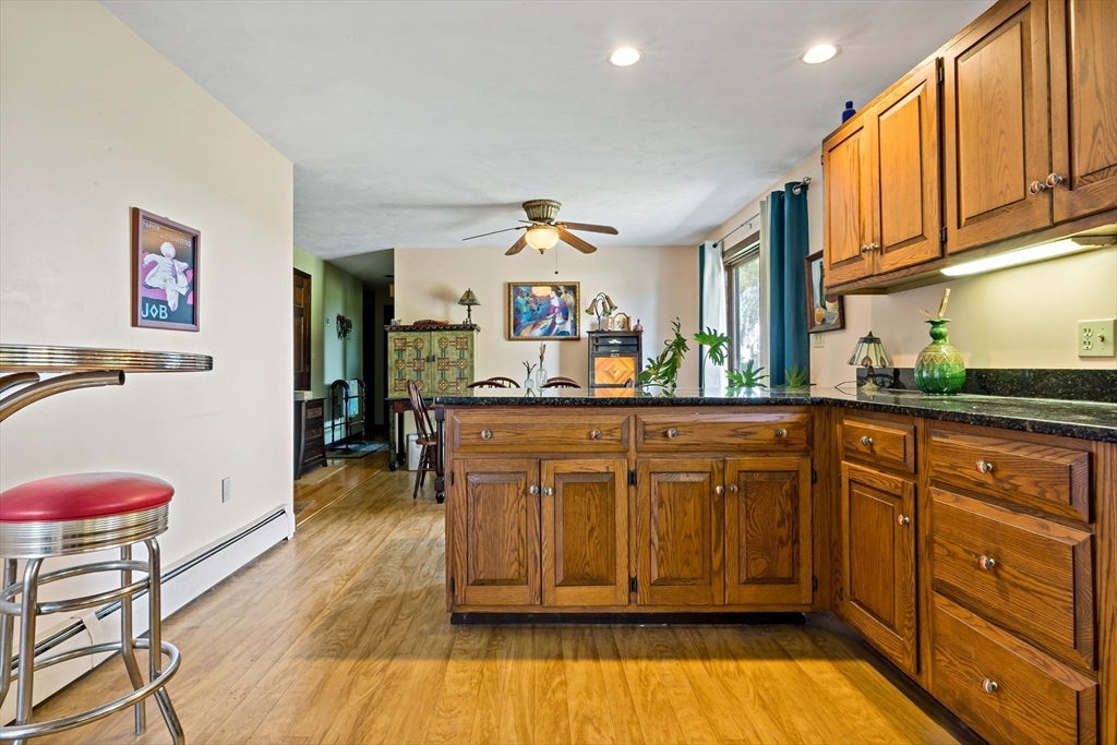 3211 Main Road Tiverton, RI 02878 - Photo 16 of 34 a kitchen with granite countertop a stove and cabinets