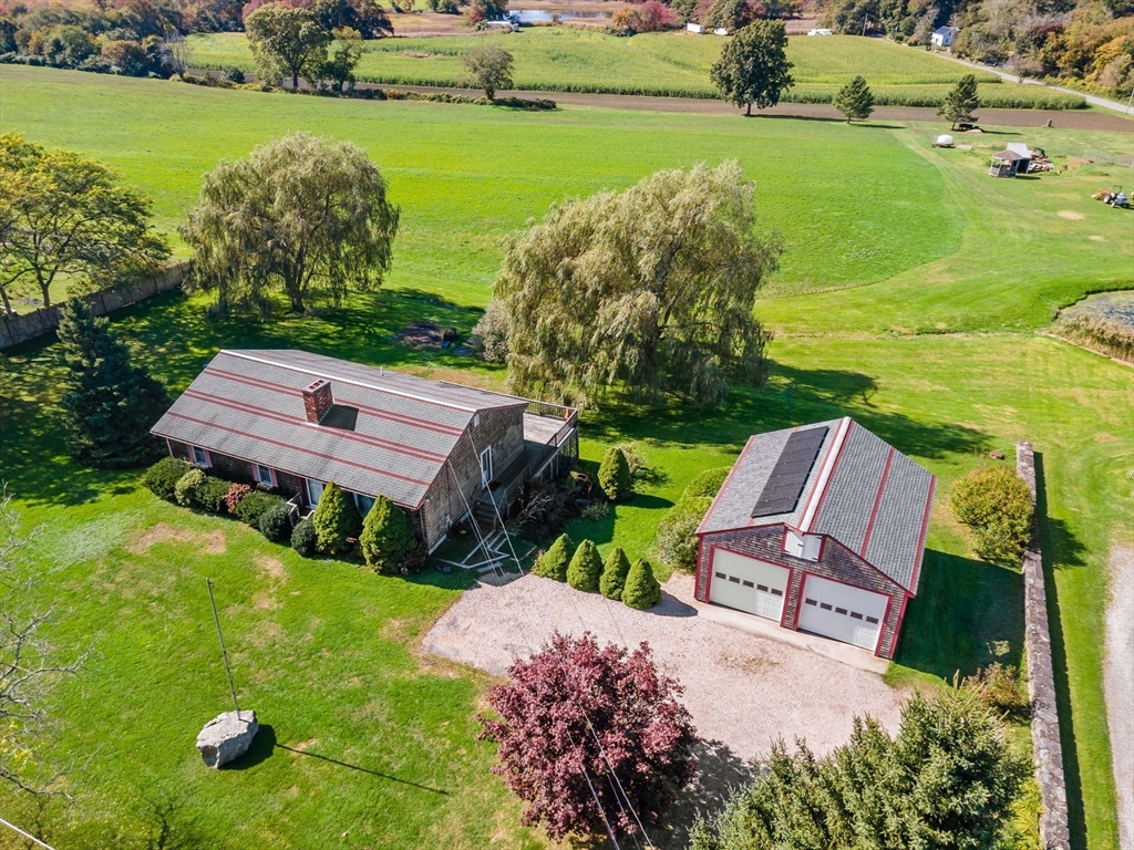 3211 Main Road Tiverton, RI 02878 - Photo 2 of 34 a view of a garden with lawn chairs