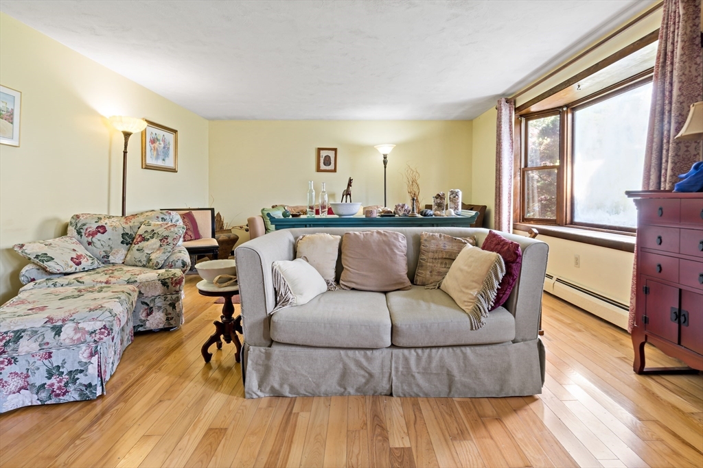 3211 Main Road Tiverton, RI 02878 - Photo 22 of 34 a living room with furniture and a large window
