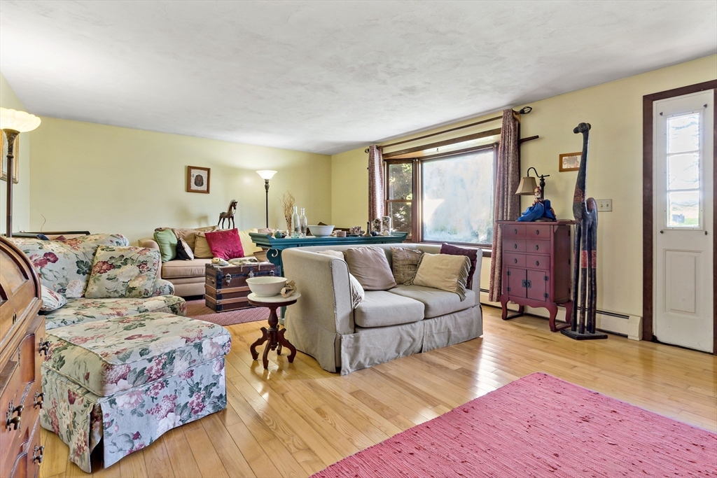 3211 Main Road Tiverton, RI 02878 - Photo 23 of 34 a living room with furniture and a window