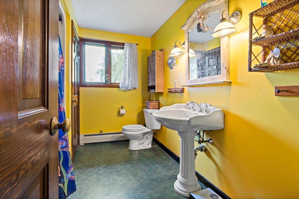 3211 Main Road Tiverton, RI 02878 - Photo 28 of 34 a bathroom with a sink and a mirror