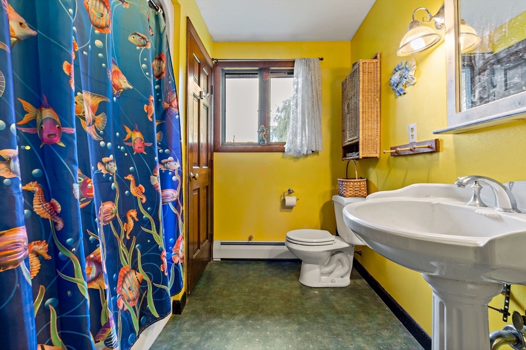 3211 Main Road Tiverton, RI 02878 - Photo 29 of 34 a bathroom with a sink and a toilet