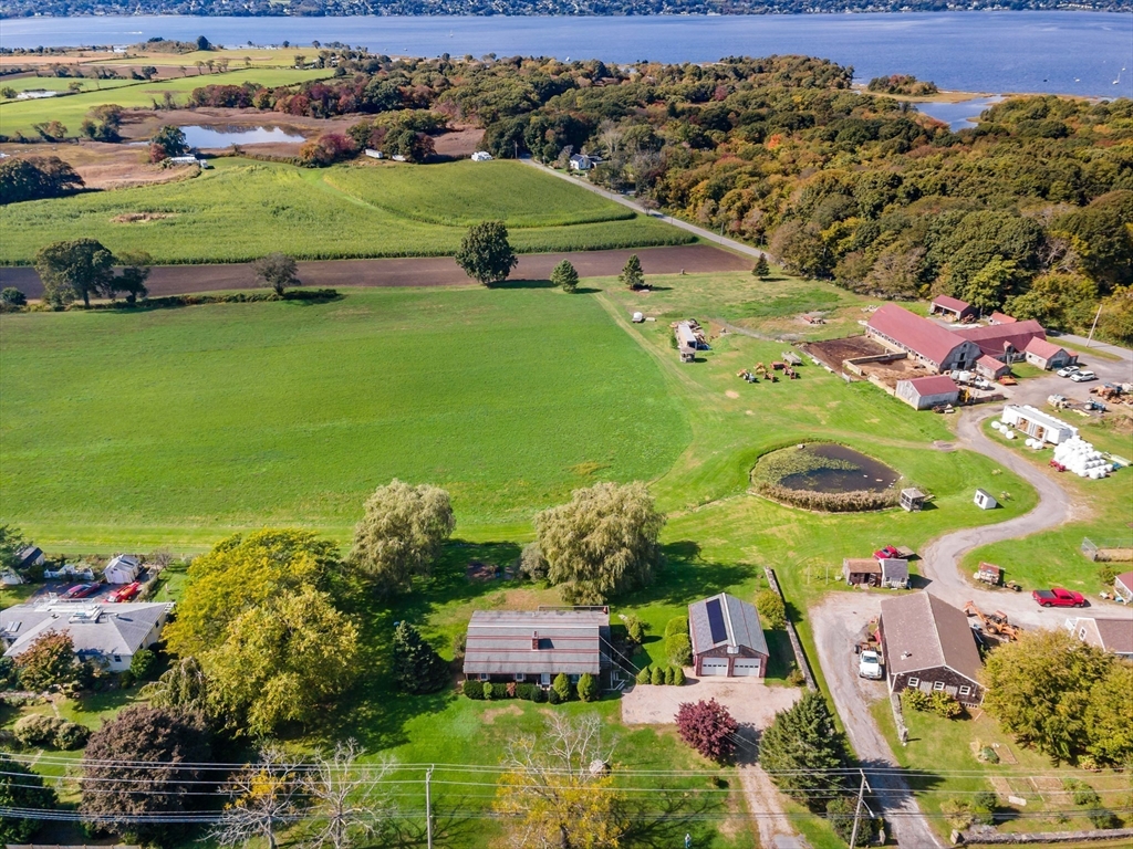 3211 Main Road Tiverton, RI 02878 - Photo 3 of 34 an aerial view of a house with a garden