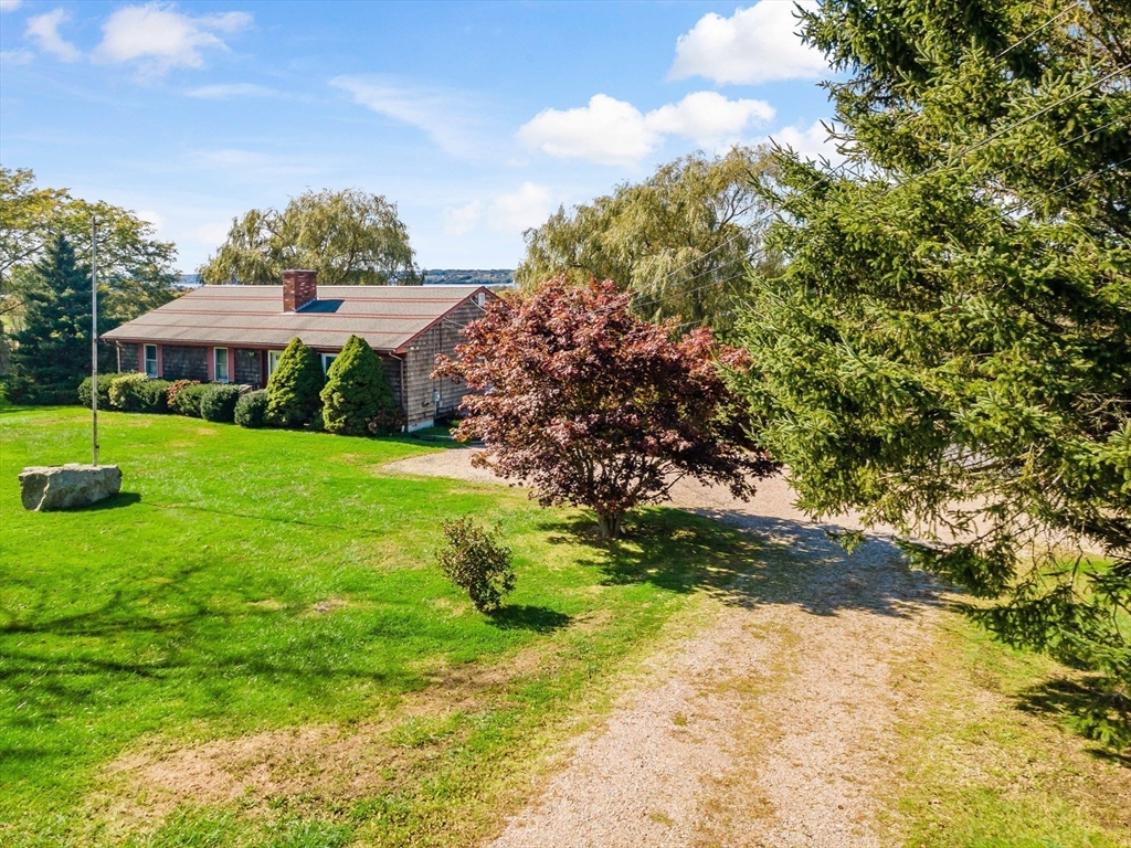 3211 Main Road Tiverton, RI 02878 - Photo 32 of 34 a view of a house with a yard