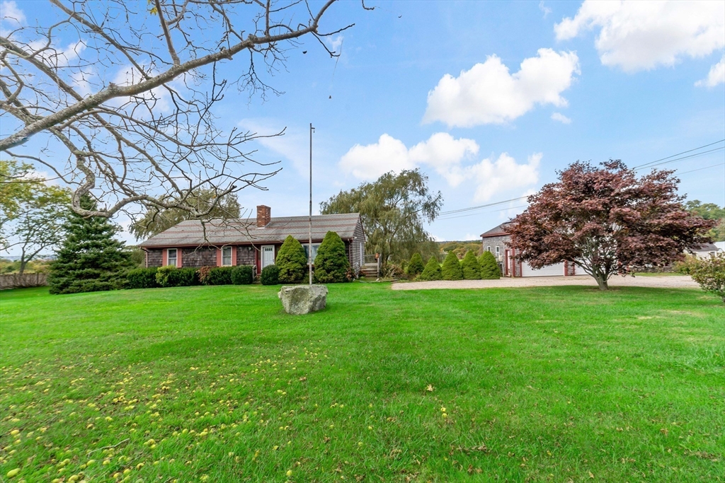 3211 Main Road Tiverton, RI 02878 - Photo 5 of 34 a view of a garden with a house