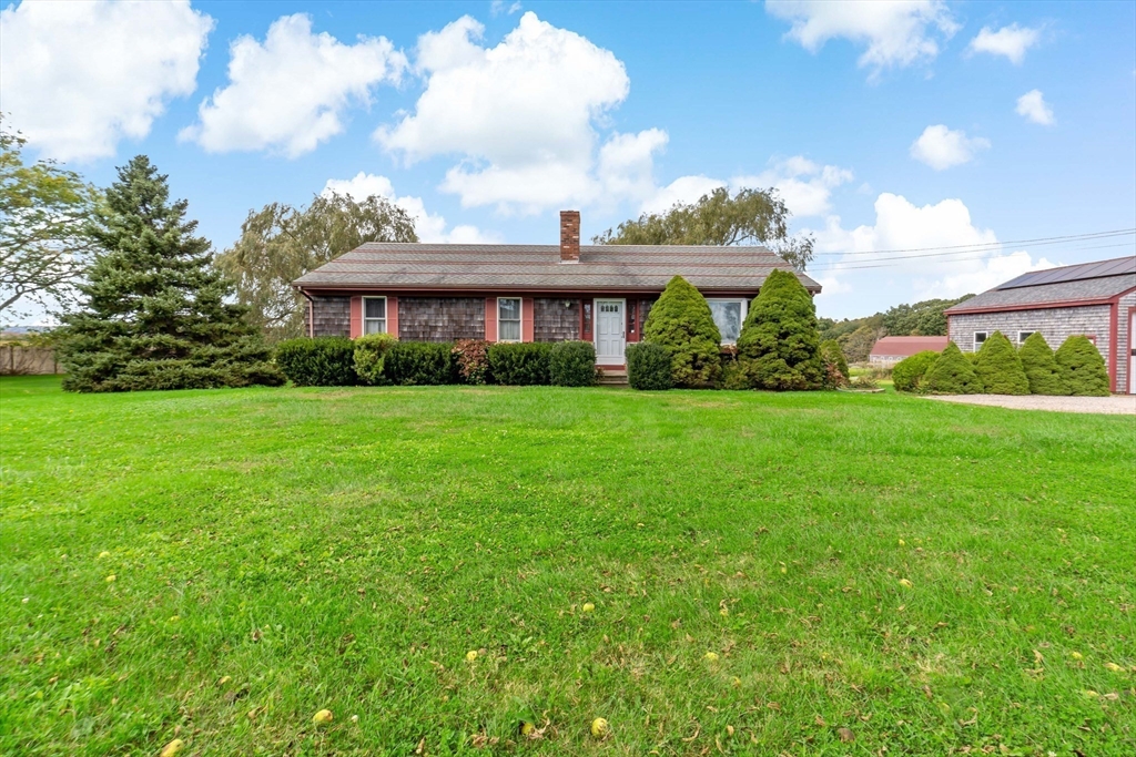 3211 Main Road Tiverton, RI 02878 - Photo 6 of 34 a view of a big yard with a house in the background