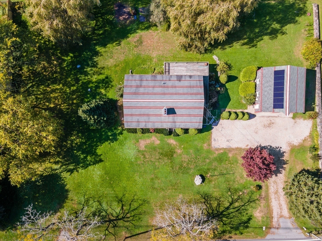 3211 Main Road Tiverton, RI 02878 - Photo 7 of 34 a view of a back yard with flower plants