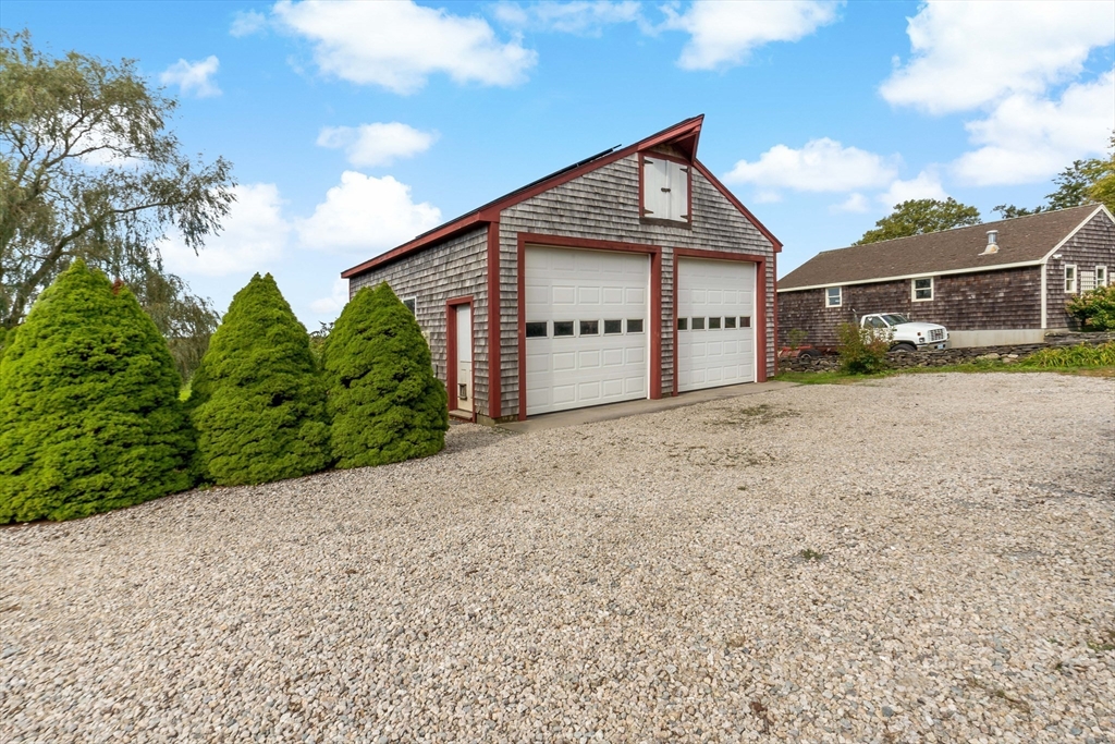 3211 Main Road Tiverton, RI 02878 - Photo 8 of 34 a view of a house with a yard and plants