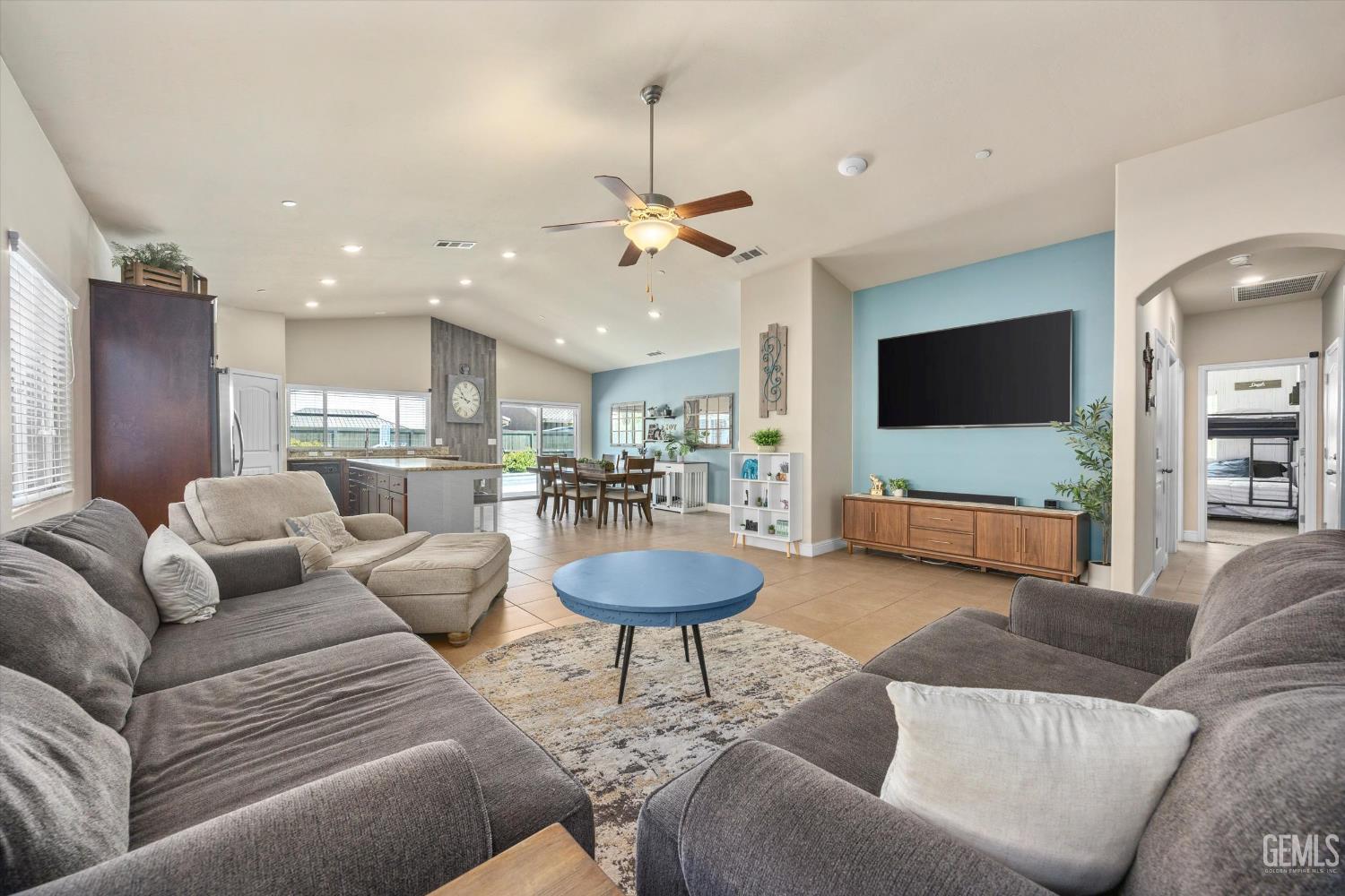 Undisclosed Address Shafter, CA 93263 - Photo 11 of 40 a living room with furniture and a flat screen tv