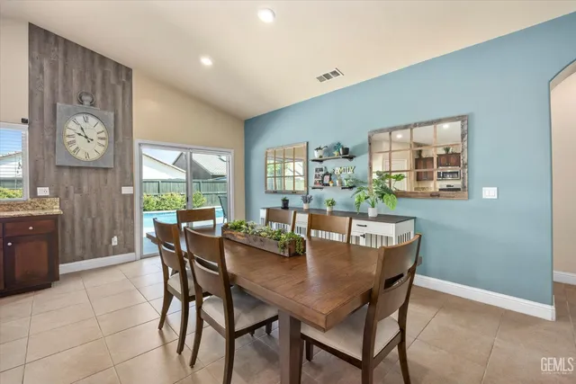 a dining room with furniture and window