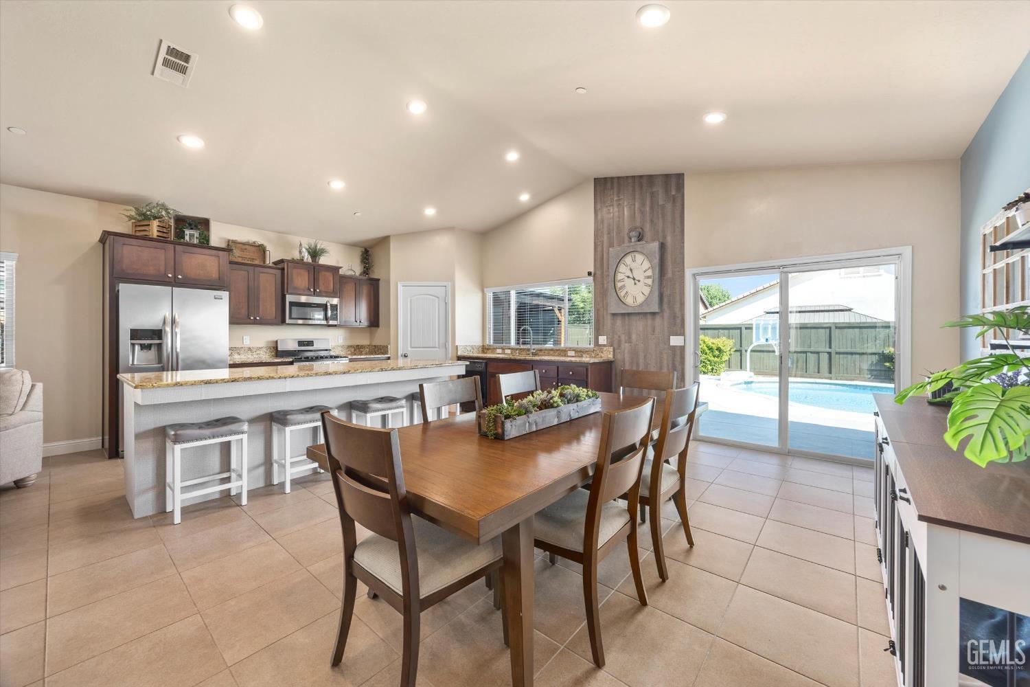 Undisclosed Address Shafter, CA 93263 - Photo 14 of 40 a dining hall with stainless steel appliances a dining table and chairs
