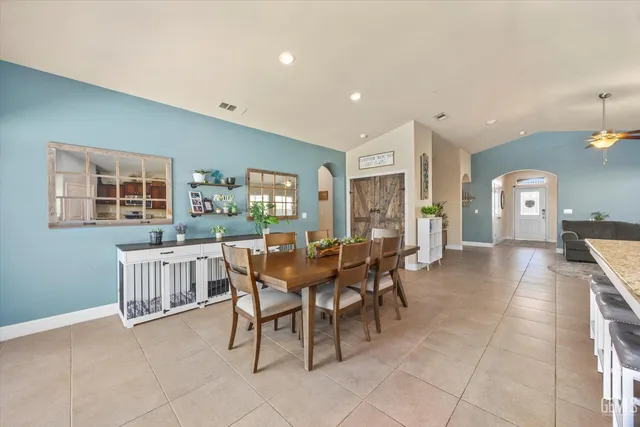 a dining room with furniture and window