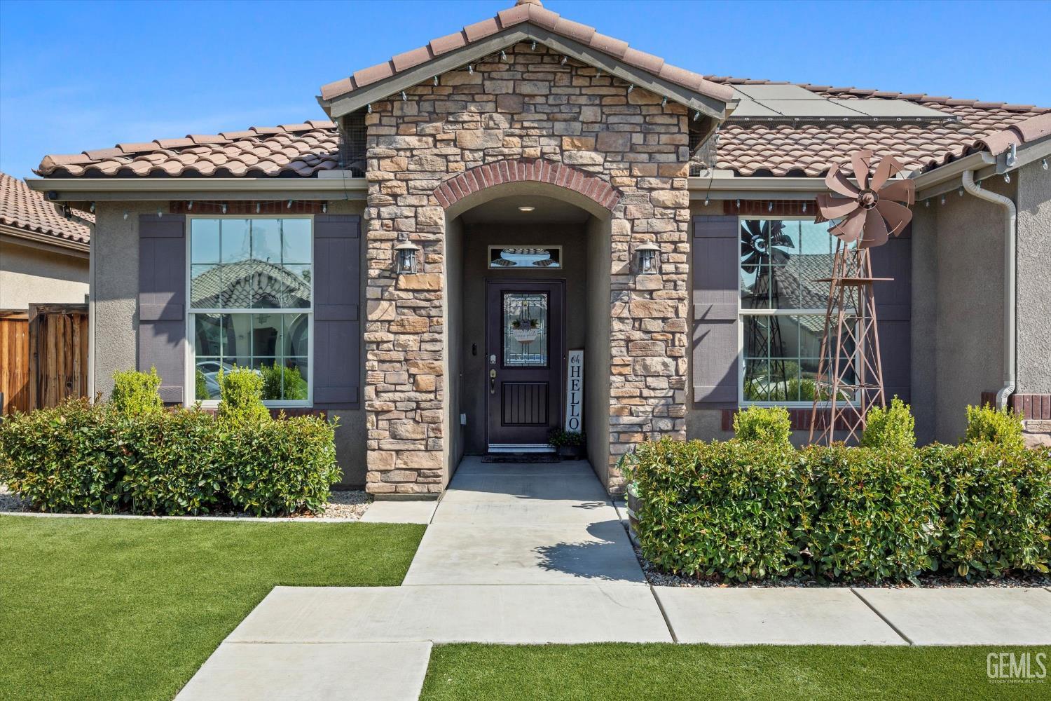 Undisclosed Address Shafter, CA 93263 - Photo 2 of 40 a front view of a house with garden