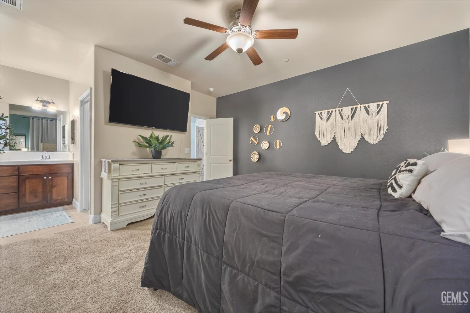 Undisclosed Address Shafter, CA 93263 - Photo 22 of 40 a bedroom with a large bed and a flat screen tv