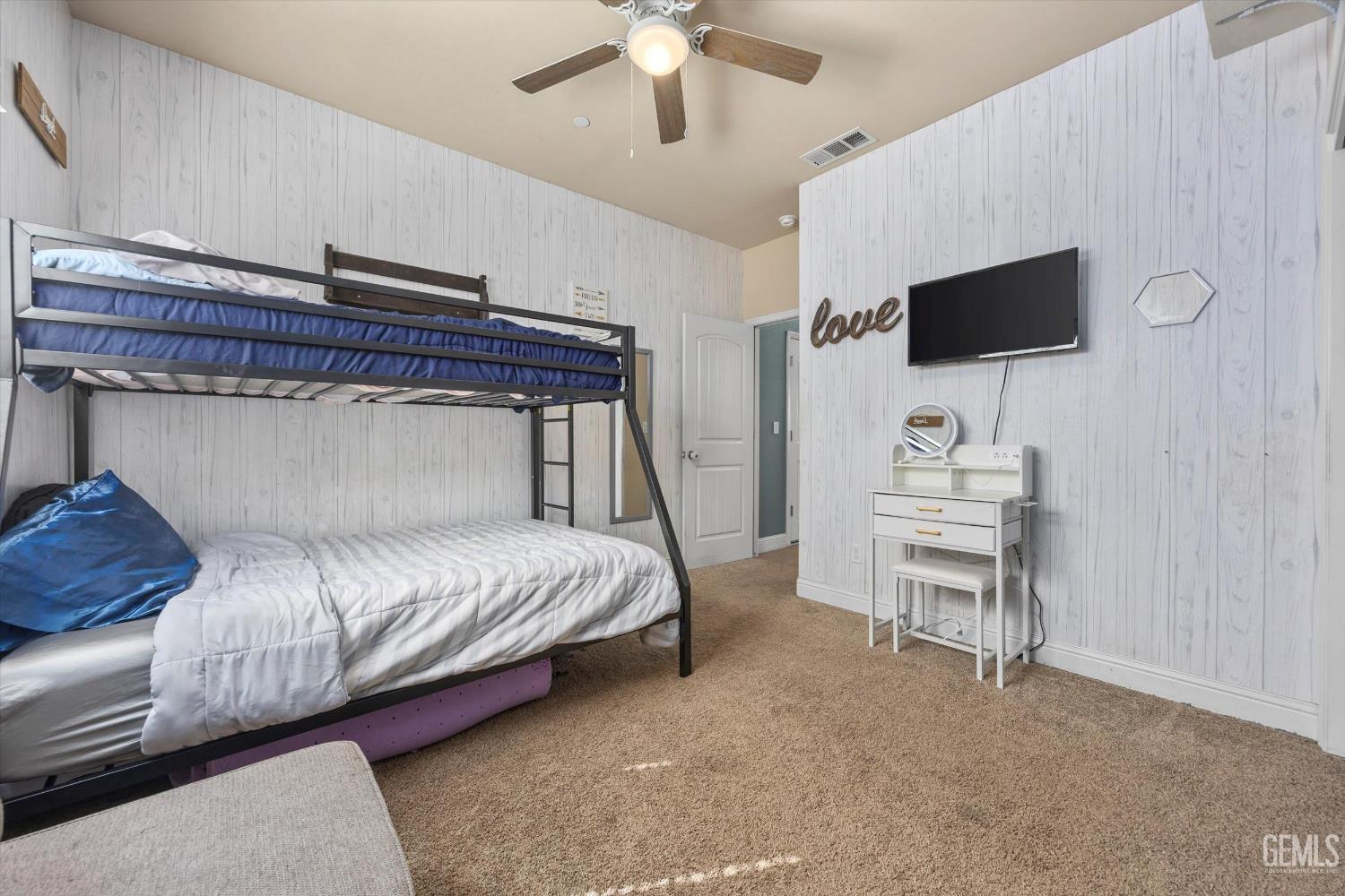 Undisclosed Address Shafter, CA 93263 - Photo 27 of 40 a bedroom with a bed tv and a chair