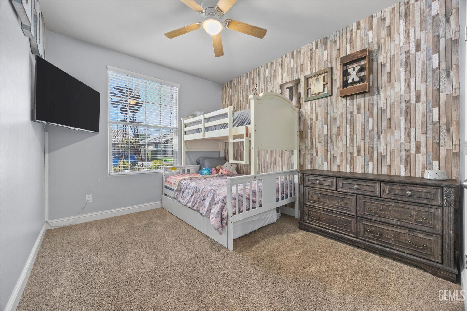 Undisclosed Address Shafter, CA 93263 - Photo 29 of 40 a bedroom with a bed and a flat tv screen on dresser