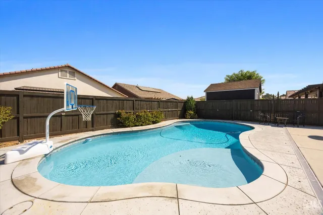 a house view with a swimming pool
