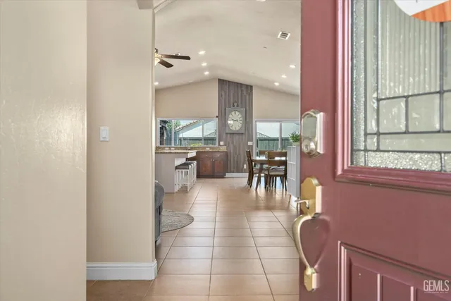 a lobby with furniture and a table