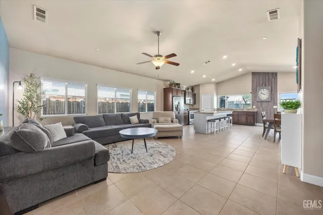 a living room with lots of furniture and a chandelier