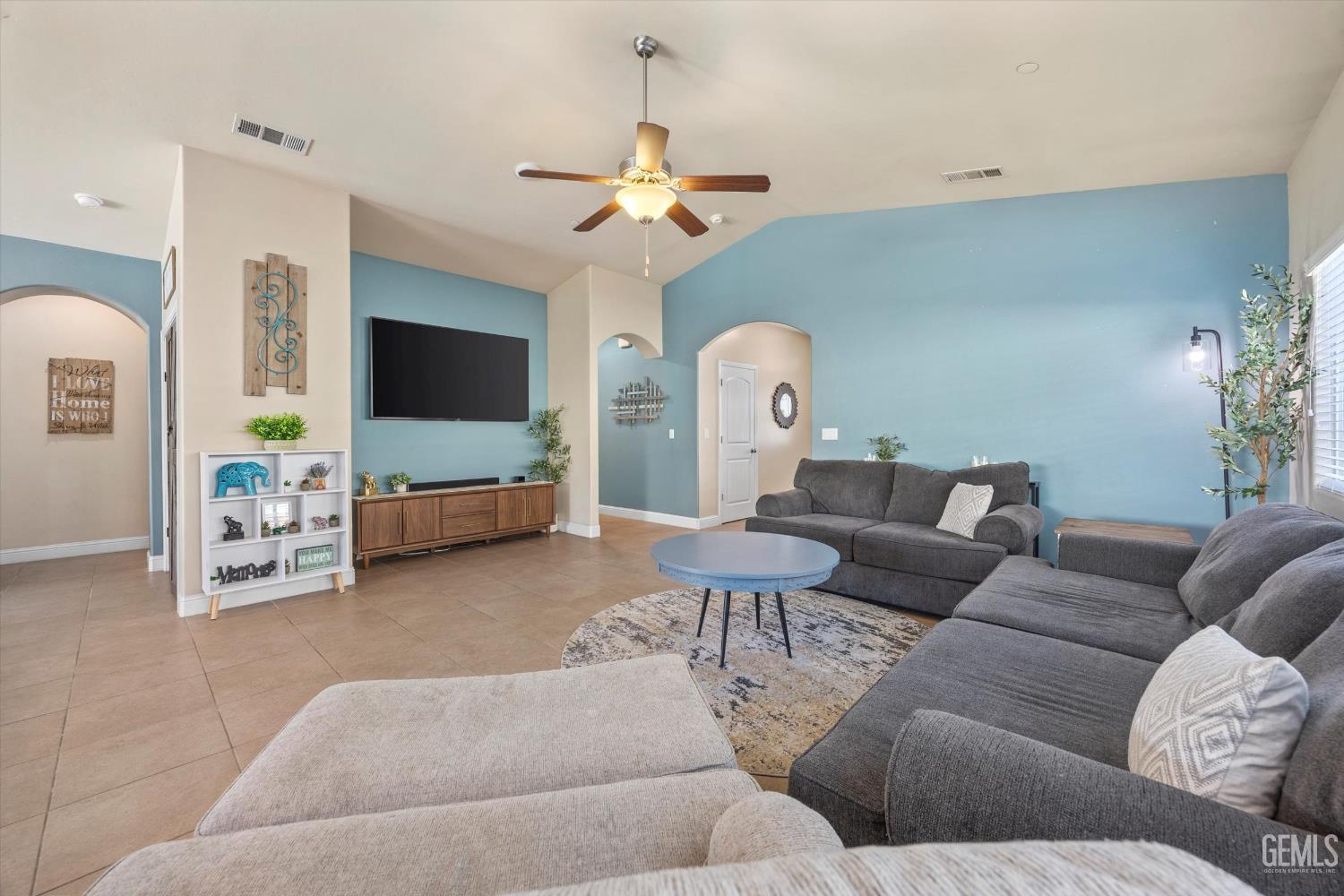Undisclosed Address Shafter, CA 93263 - Photo 10 of 40 a living room with furniture and a chandelier