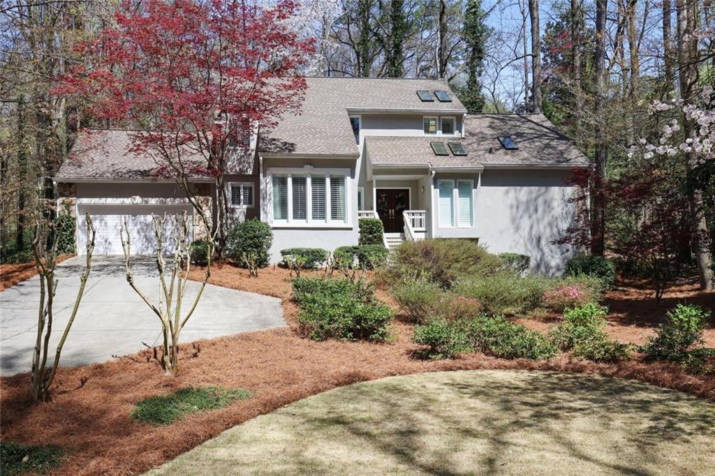 80 Seville Chase Atlanta, GA 30328 - Photo 1 of 1 a view of house with outdoor space and trees