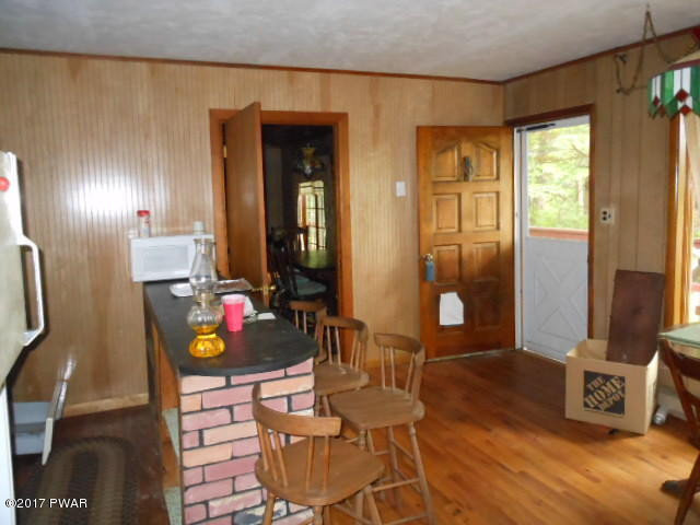 207 Aspen Road Dingmans Ferry, PA 18328 - Photo 7 of 22 a living room with furniture and wooden floor