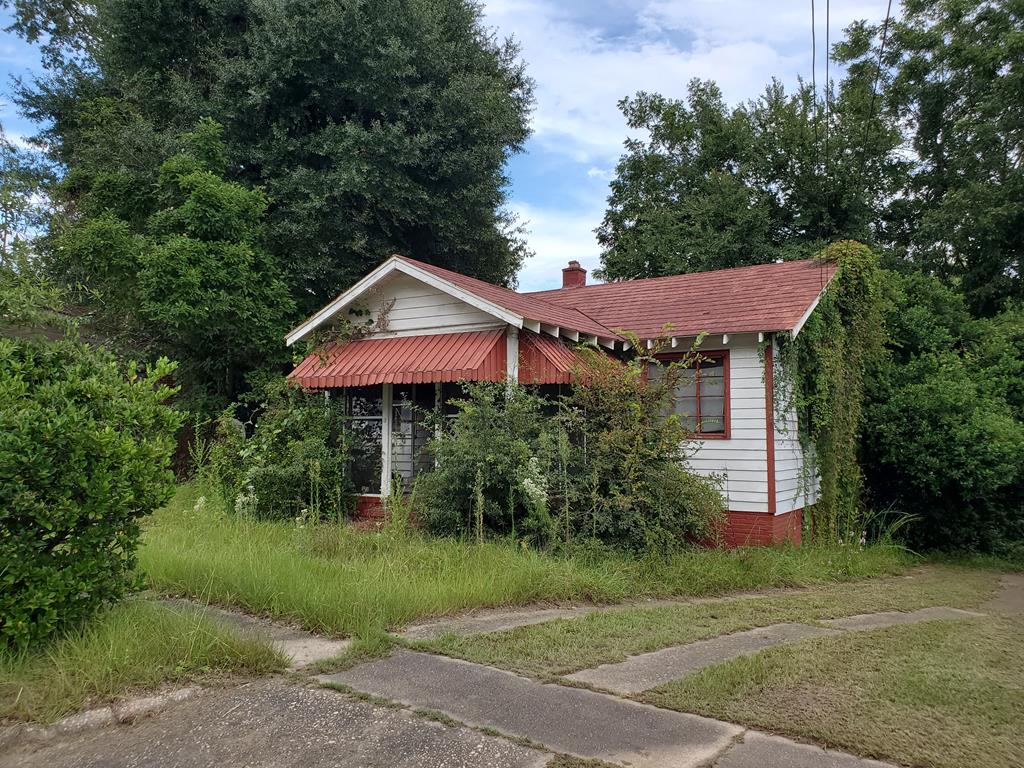 348 Liberty Avenue Columbus, GA 31903 - Photo 1 of 8 a front view of a house with a yard and trees