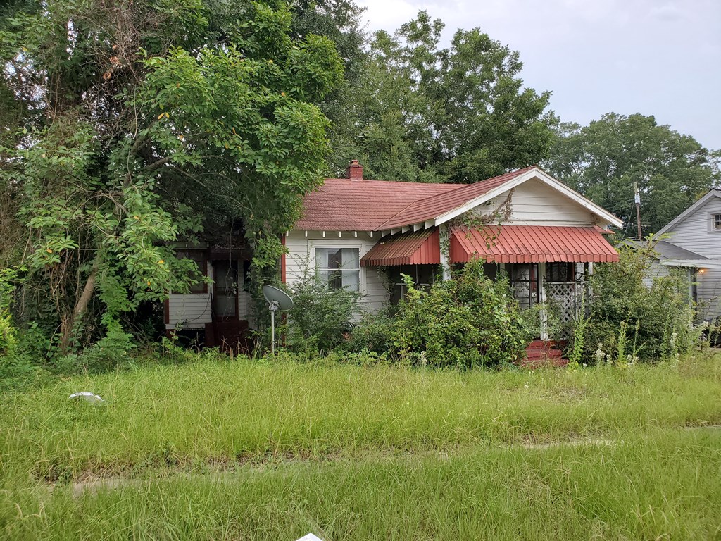 348 Liberty Avenue Columbus, GA 31903 - Photo 2 of 8 a front view of a house with a yard and trees