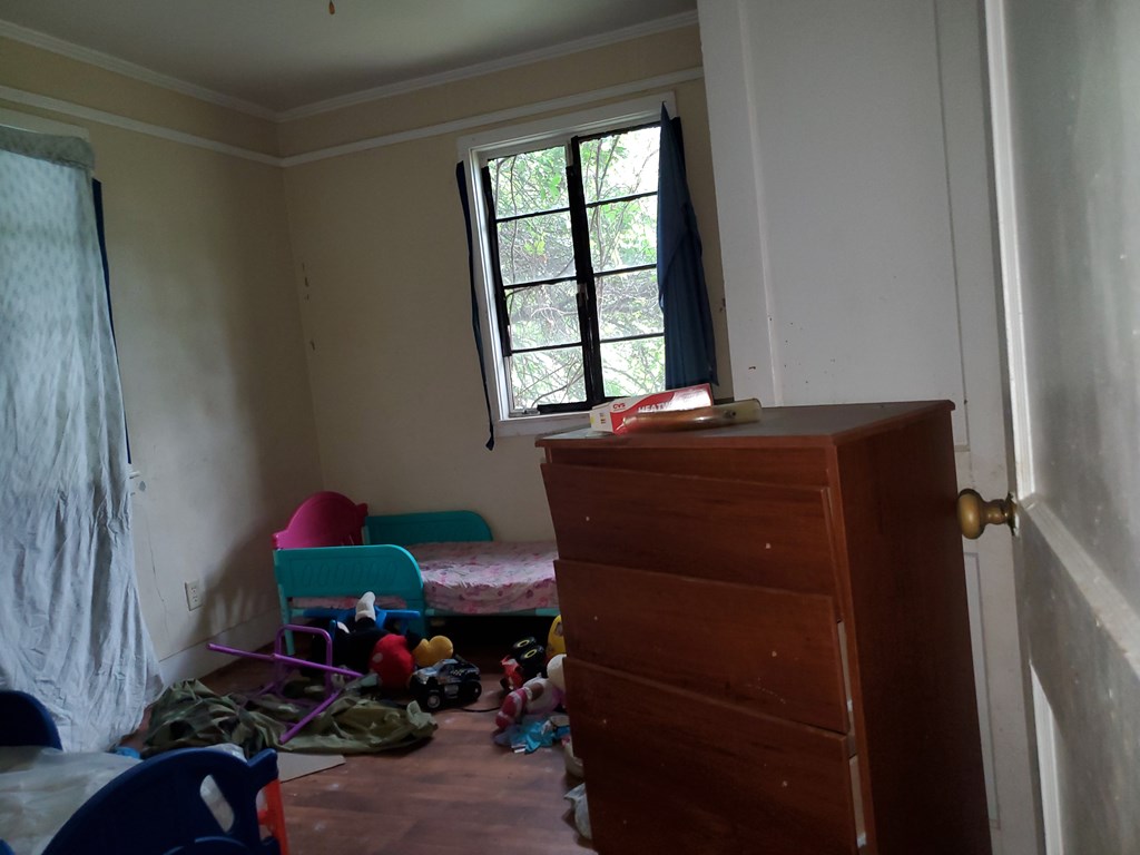348 Liberty Avenue Columbus, GA 31903 - Photo 6 of 8 a room with a window and furniture