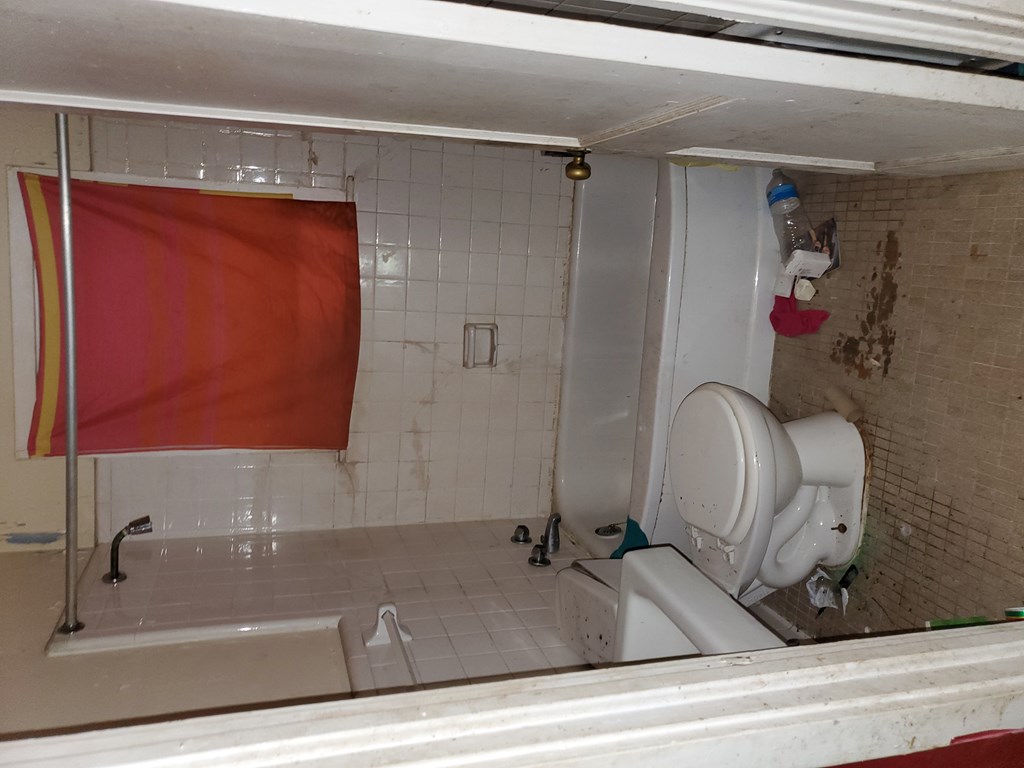 348 Liberty Avenue Columbus, GA 31903 - Photo 7 of 8 a bathroom with a sink and a mirror