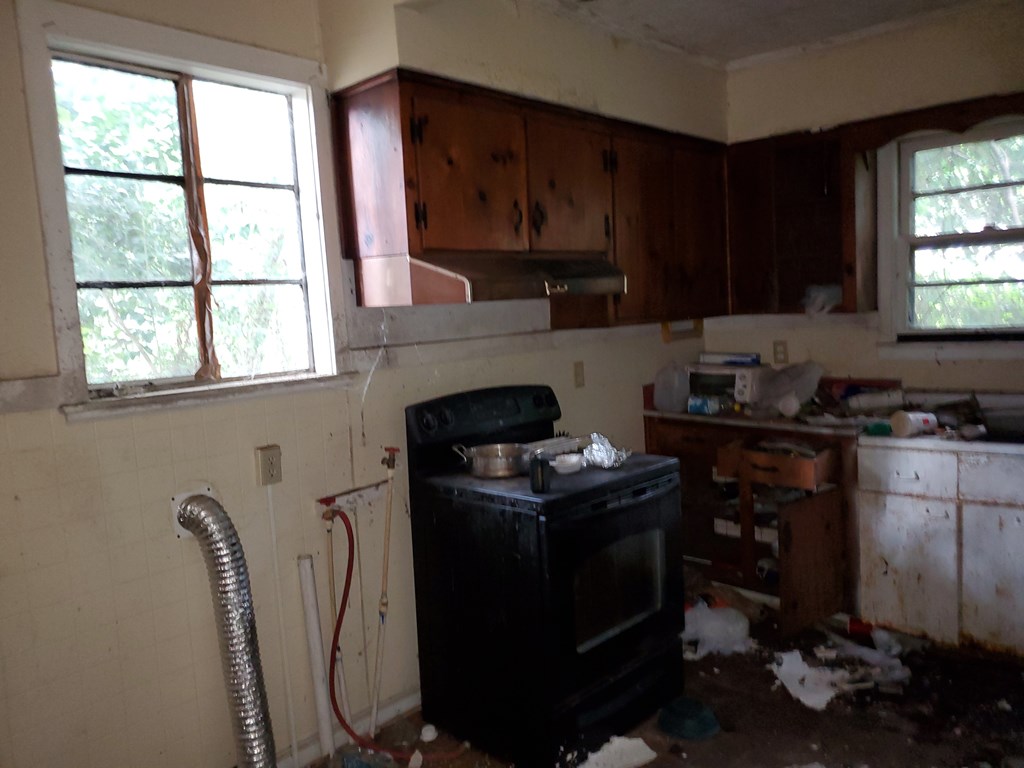 348 Liberty Avenue Columbus, GA 31903 - Photo 8 of 8 a kitchen with a cabinets appliances and a window