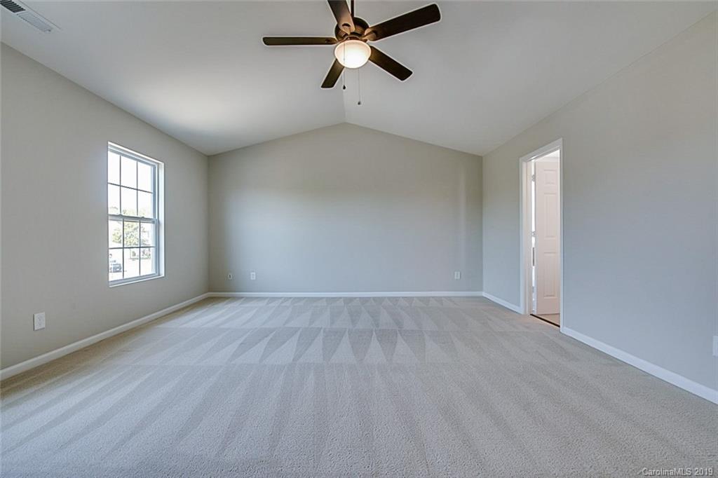 1022 Yellow Bee Road Indian Trail, NC 28079 - Photo 11 of 20 an empty room with windows and fan