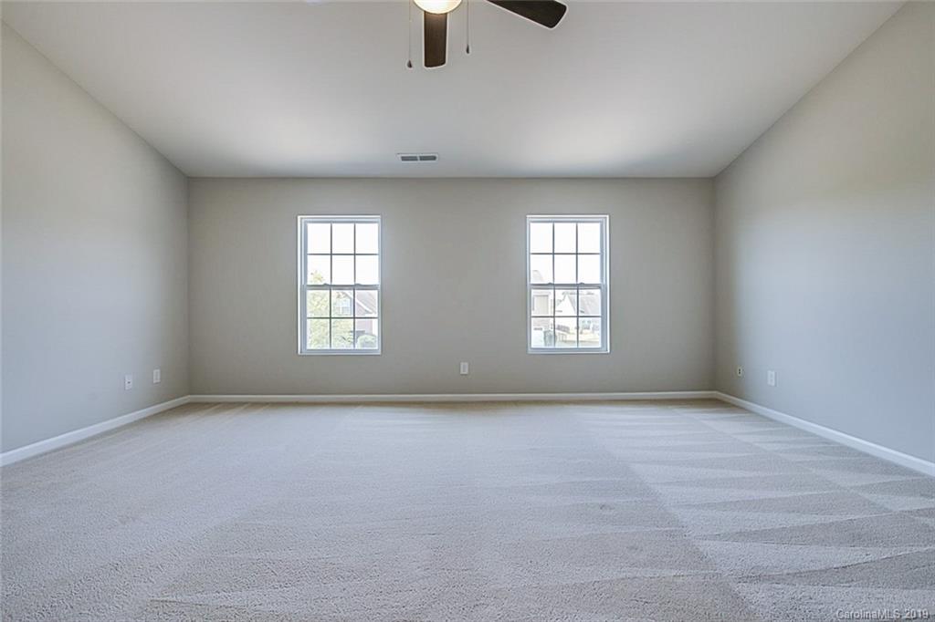 1022 Yellow Bee Road Indian Trail, NC 28079 - Photo 12 of 20 an empty room with windows and fan