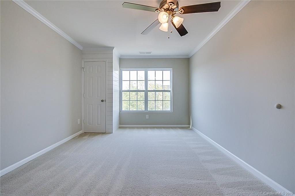 1022 Yellow Bee Road Indian Trail, NC 28079 - Photo 16 of 20 an empty room with windows and fan