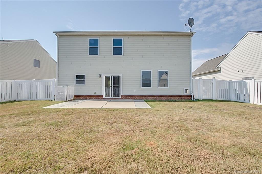 1022 Yellow Bee Road Indian Trail, NC 28079 - Photo 5 of 20 a house that has a big yard with wooden fence
