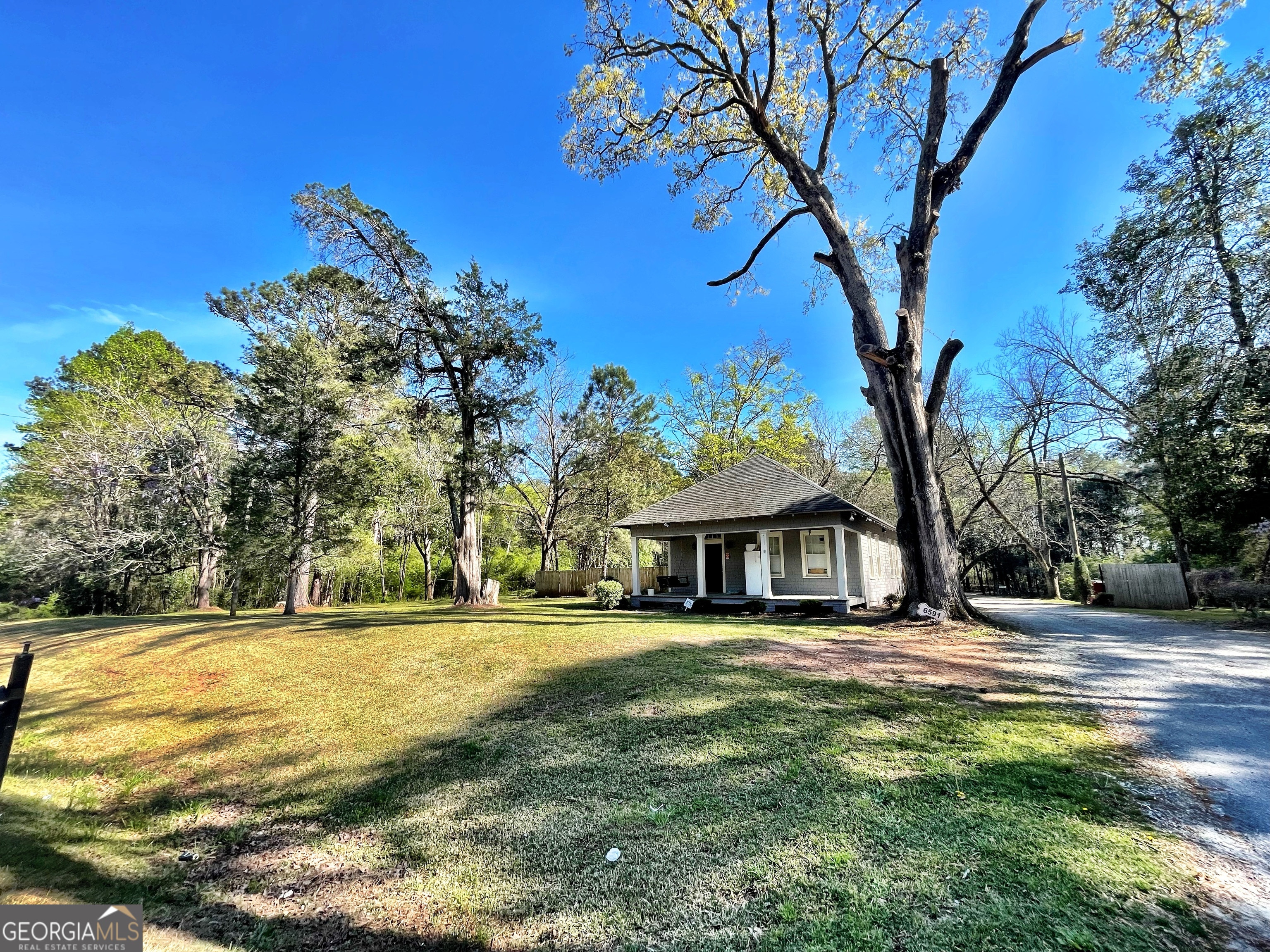 6591 Thomaston Road Macon, GA 31220 - Photo 12 of 30 a front view of a house with a yard