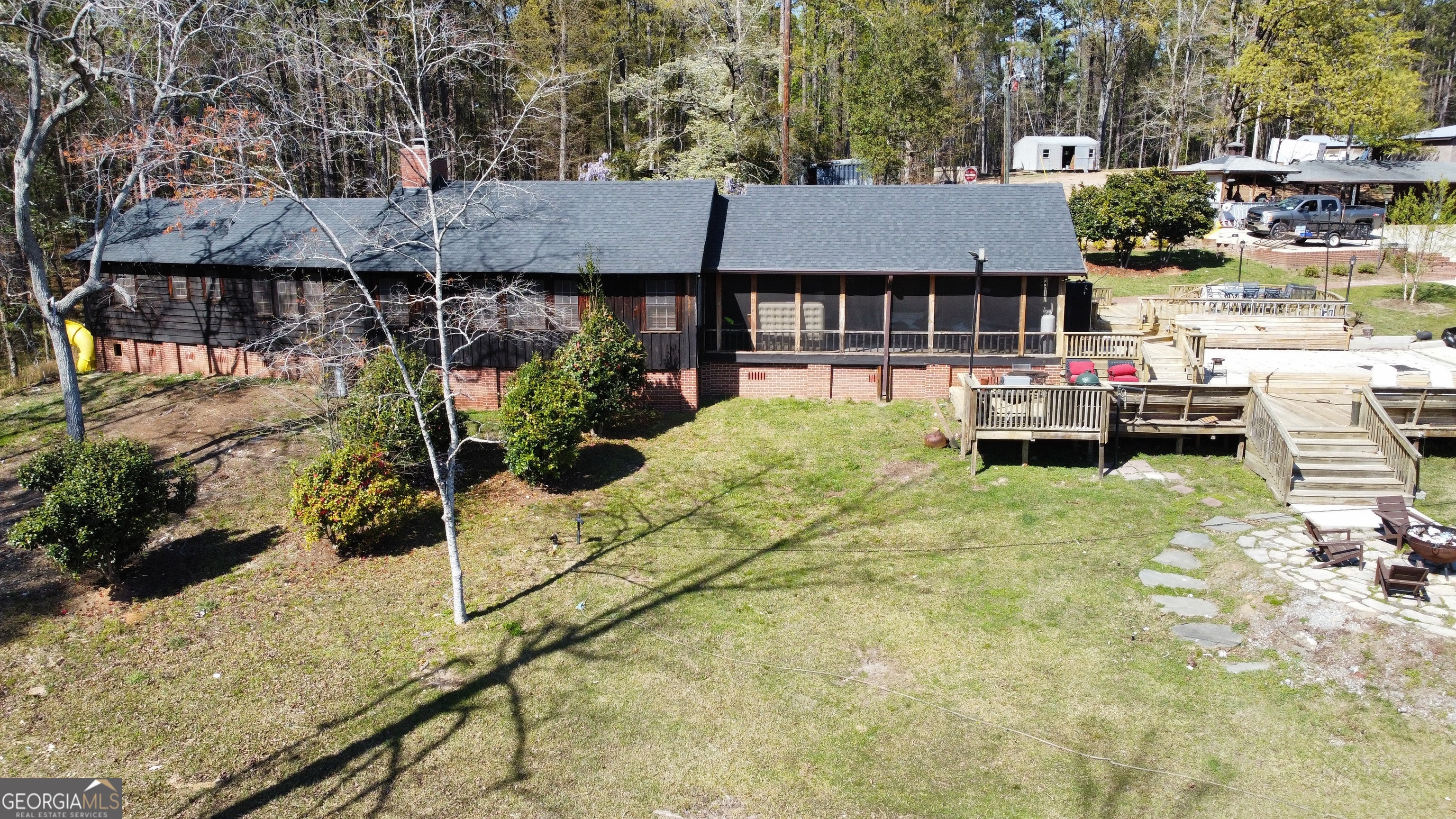 6591 Thomaston Road Macon, GA 31220 - Photo 24 of 30 a view of house with backyard and seating area