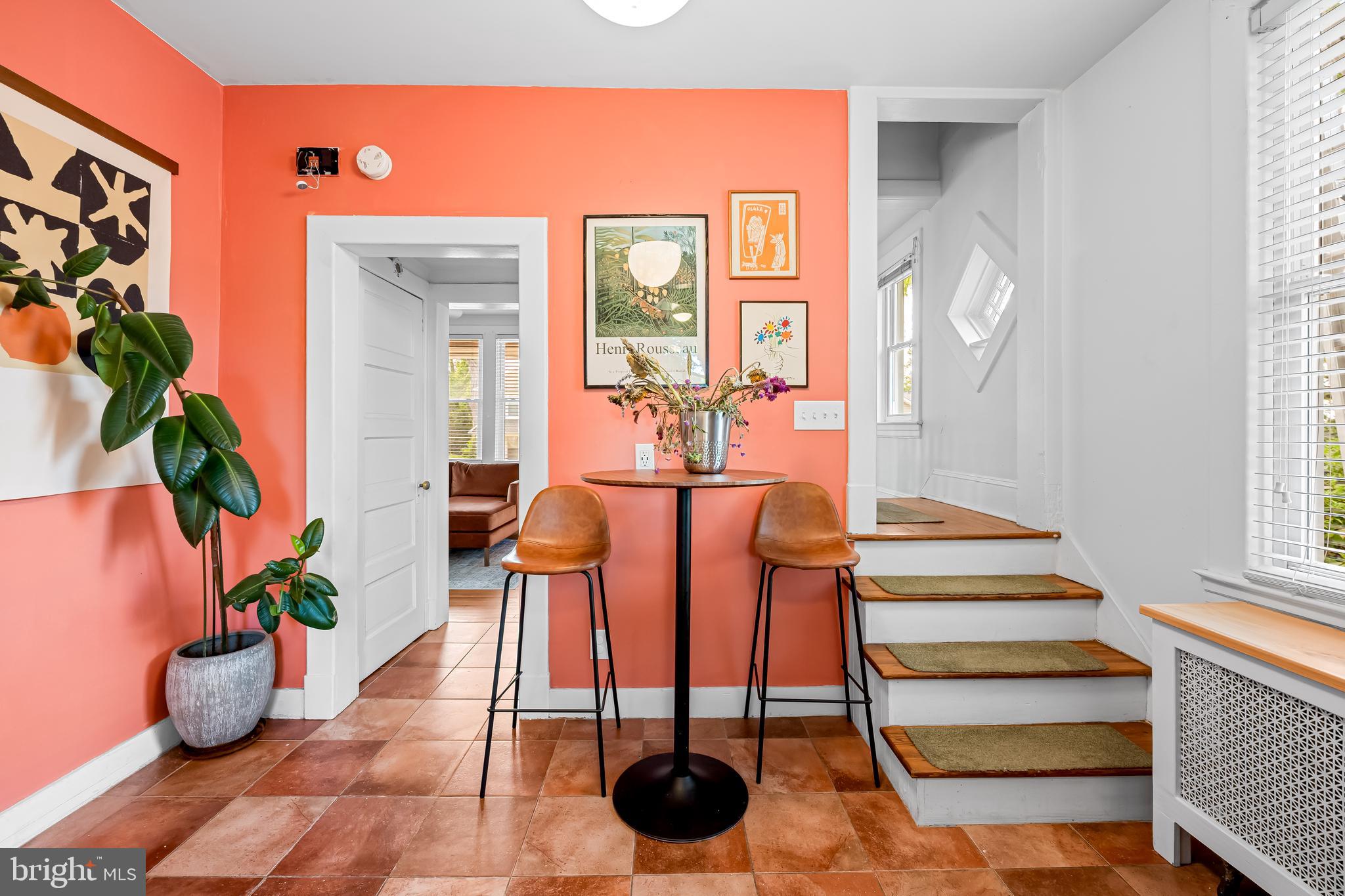 5009 Catalpha Road Baltimore, MD 21214 - Photo 17 of 38 a dining room with furniture and wooden floor