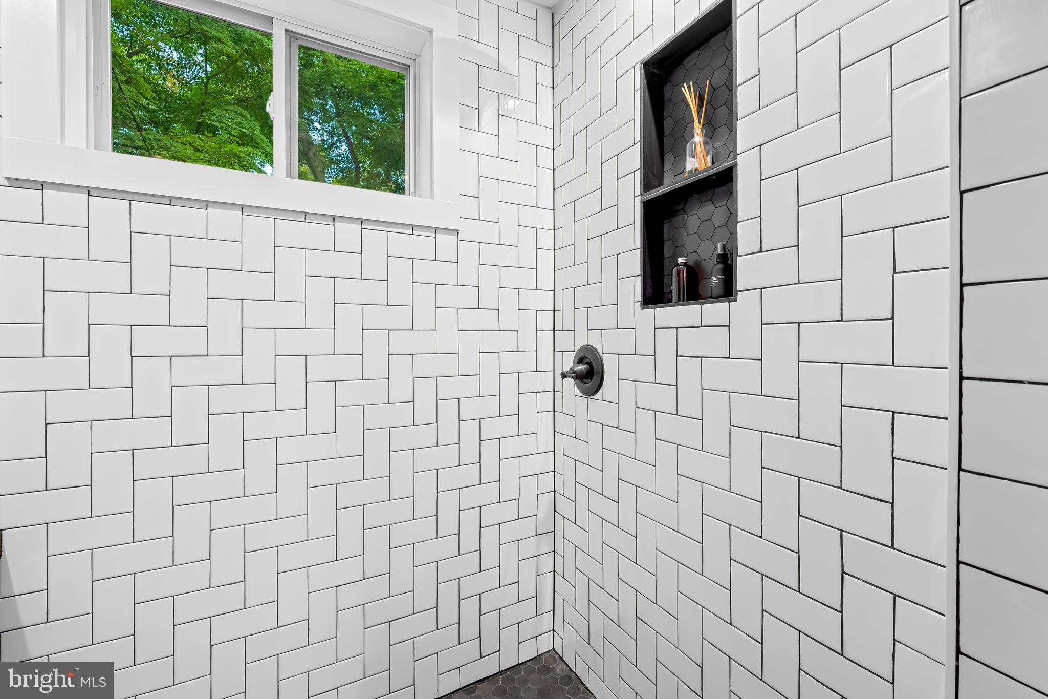 5009 Catalpha Road Baltimore, MD 21214 - Photo 19 of 38 a bathroom with a shower