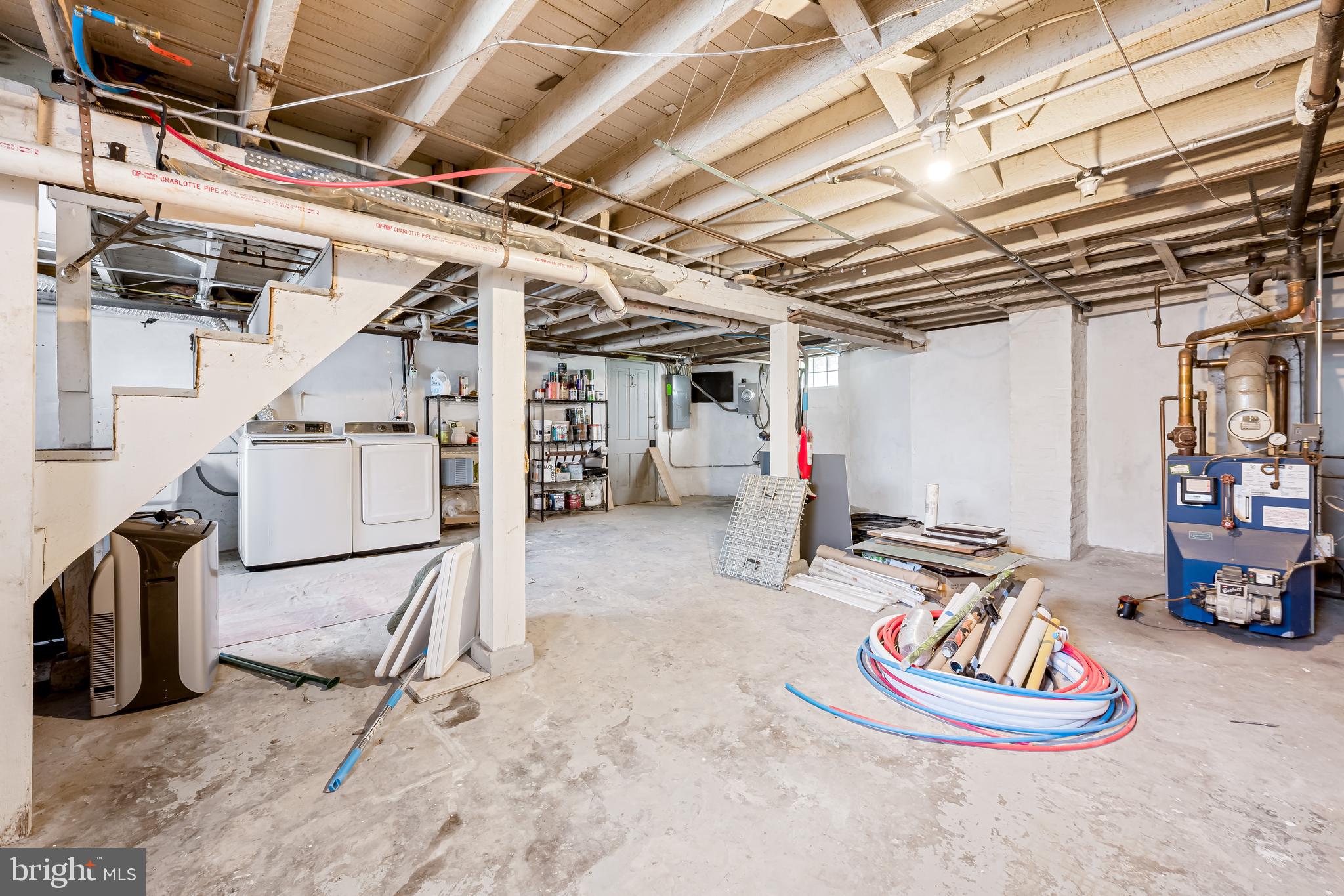 5009 Catalpha Road Baltimore, MD 21214 - Photo 29 of 38 a living room with lots of furniture and a gym equipment