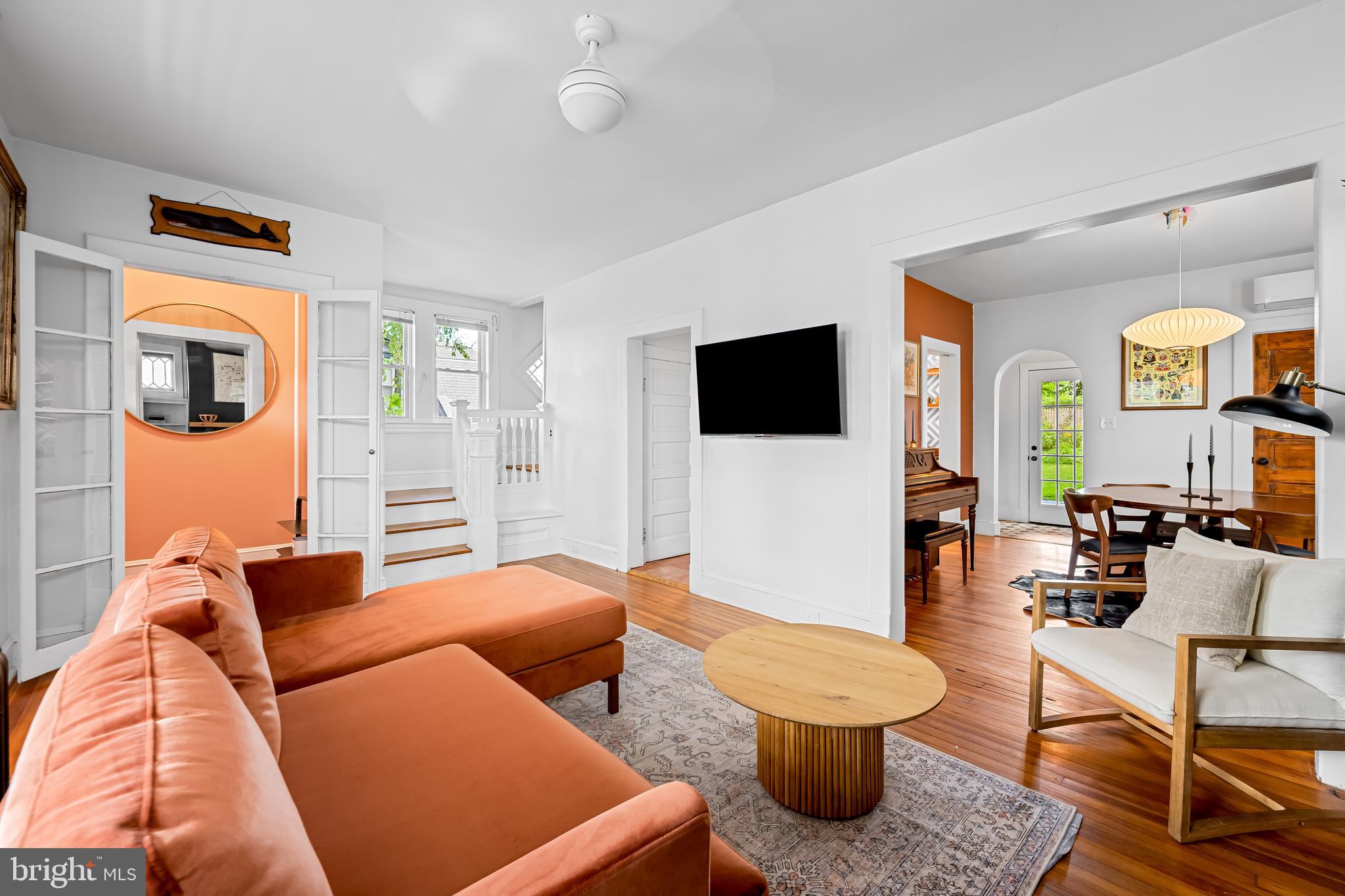 5009 Catalpha Road Baltimore, MD 21214 - Photo 4 of 38 a living room with furniture and a flat screen tv
