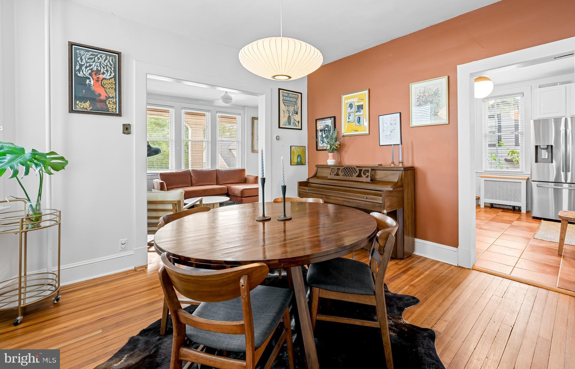 5009 Catalpha Road Baltimore, MD 21214 - Photo 8 of 38 a dining room with furniture and wooden floor