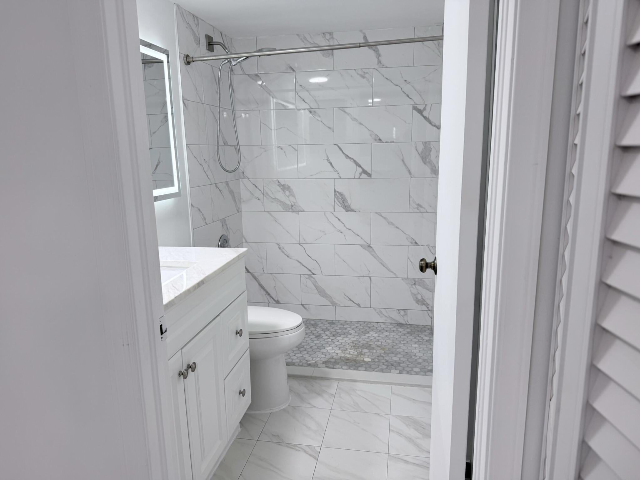 300 East Club Circle, Unit 107 Boca Raton, FL 33487 - Photo 13 of 16 2nd bath shower