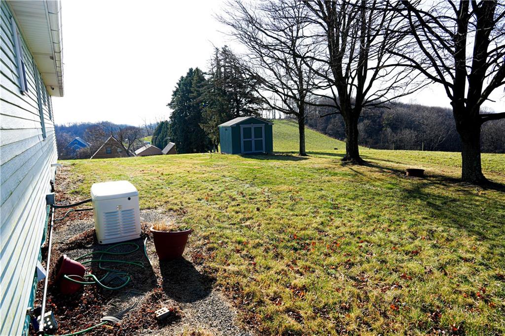 1390 Garretts Run Road Ford City, PA 16226 - Photo 21 of 24 a view of a yard with an trees