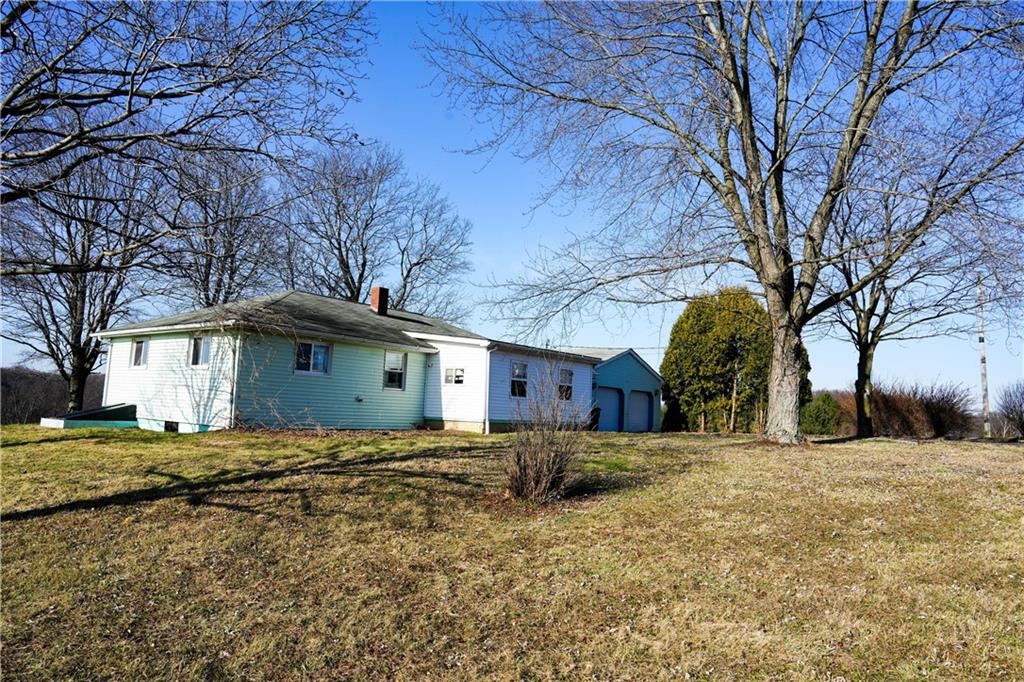 1390 Garretts Run Road Ford City, PA 16226 - Photo 23 of 24 a large house with a large tree in front of it