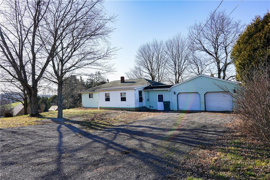 1390 Garretts Run Road Ford City, PA 16226 - Photo 24 of 24 a view of a house with a yard covered in snow