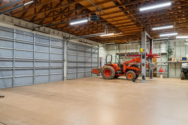a view of a garage with parked cars