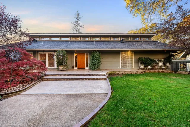 a front view of a house with garden
