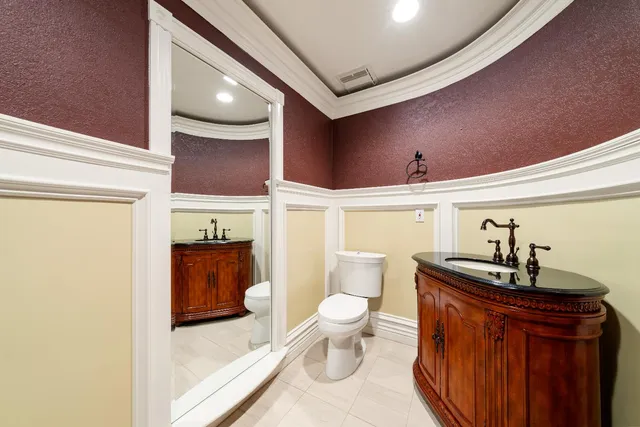 a spacious bathroom with a sink a toilet and shower
